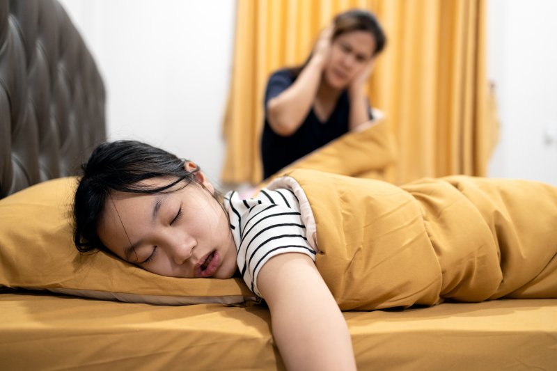 a woman snoring with sleep apnea 