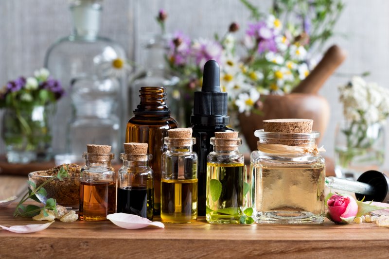 Several essential oils sitting on a table