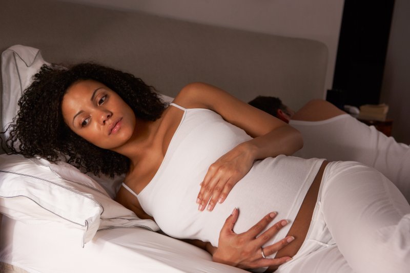 a pregnant woman having trouble resting due to sleep apnea 