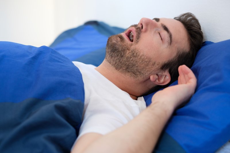 A man snoring with sleep apnea